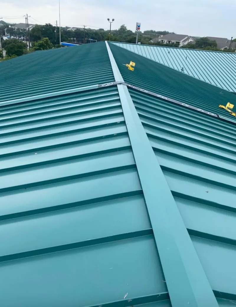Green commercial metal roof ridge and valley for Metal Roof Repair in North Tonawanda